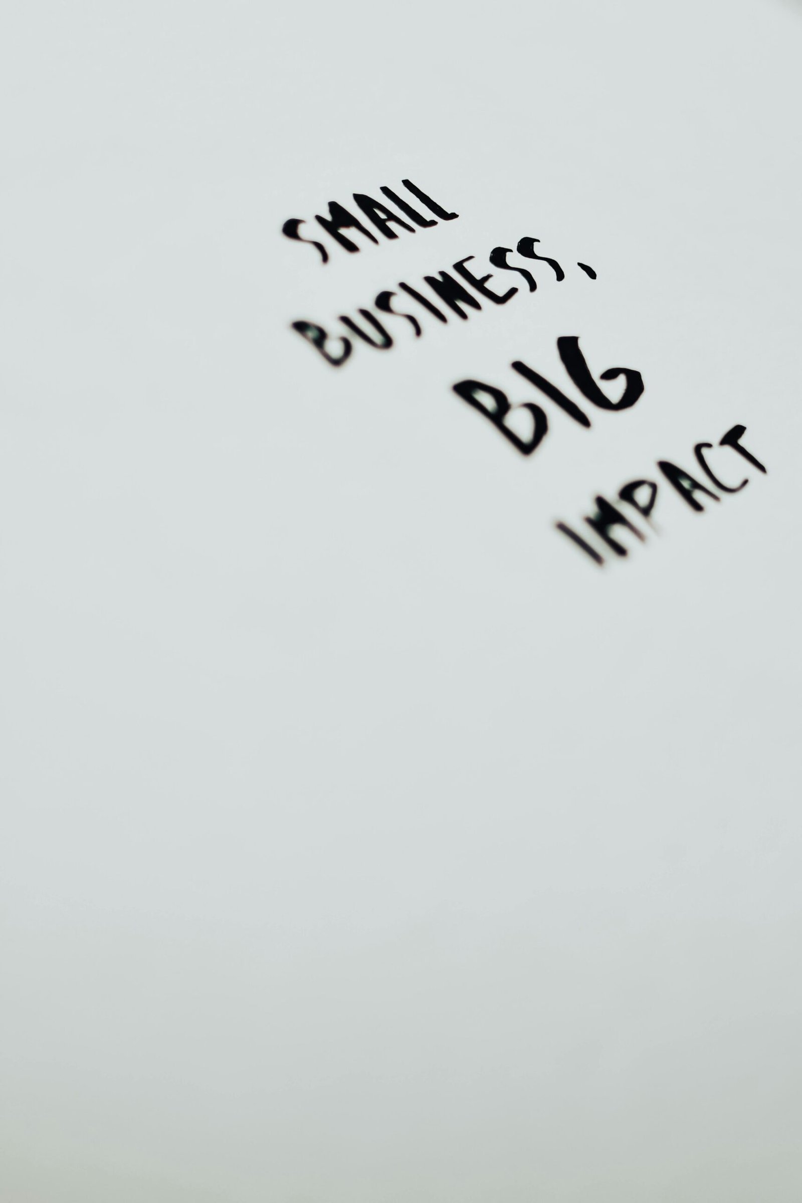 A motivational quote highlighting the impact of small businesses on a minimalist background.